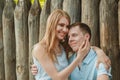 Portrait of Happy Couple Hugging Laughing Wooden Background