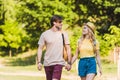 portrait of happy couple in love walking in summer