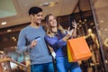 Portrait of a happy couple showing their new credit card Royalty Free Stock Photo