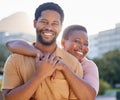 Portrait, happy and couple smile with hug while in the city on a date in summer. African american man and woman bonding Royalty Free Stock Photo