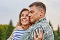 Portrait of happy couple with soldier. Royalty Free Stock Photo