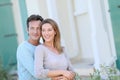 Portrait of a happy couple standing on front of the house Royalty Free Stock Photo