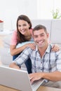 Portrait of happy couple using laptop Royalty Free Stock Photo