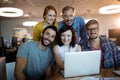 Portrait of happy creative business team working on the laptop Royalty Free Stock Photo