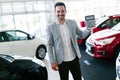 Portrait of happy customer buying new car Royalty Free Stock Photo