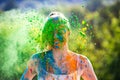 Portrait of happy cute girl on holi color festival of colors. Color powder on faces and body. Royalty Free Stock Photo