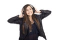 Portrait of happy cute girl listening music on her headphones Royalty Free Stock Photo