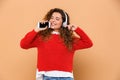 Portrait of a happy cute girl listening to music Royalty Free Stock Photo