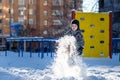 Portrait of happy cute little kid boy in colorful warm winter fashion clothes. Funny child having fun in forest or park on cold da Royalty Free Stock Photo