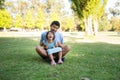 Portrait of happy dad having fun with little daughter in park Royalty Free Stock Photo