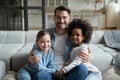 Portrait of happy dad relax at home with small daughters