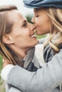 portrait of happy daughter kissing her mother Royalty Free Stock Photo