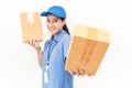 Portrait of happy delivery asian woman her hands holding cardboard box Royalty Free Stock Photo