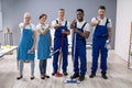 Janitors Showing Thumb Up Sign In The Office Royalty Free Stock Photo