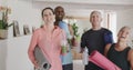 Portrait of happy diverse seniors and female pilates coach with drinks, unaltered, in slow motion