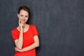 Portrait of happy dreamy girl touching cheek with one hand Royalty Free Stock Photo