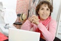 Portrait of happy dressmaker woman in studio