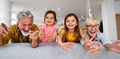 Portrait of happy elderly couple and grandchildren playing together Royalty Free Stock Photo