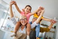 Portrait of happy elderly couple and grandchildren playing together Royalty Free Stock Photo