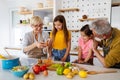 Portrait of happy elderly couple and grandchildren playing together Royalty Free Stock Photo