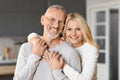 Portrait of happy elderly man and woman hugging and smiling Royalty Free Stock Photo