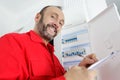 portrait happy electrician standing next to fuseboard Royalty Free Stock Photo