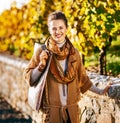 Portrait of happy elegant brunette woman in autumn park Royalty Free Stock Photo