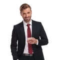 Portrait of happy elegant businessman sending an email Royalty Free Stock Photo