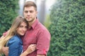 Portrait of happy embracing couple in park