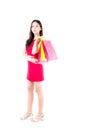 Portrait of a happy excited asian woman in red dress standing and holding colorful shopping bags with happy isolated Royalty Free Stock Photo