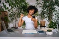 Portrait of happy excited black female woman reading great news on smartphone, screaming with joy enjoy success sitting Royalty Free Stock Photo
