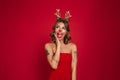 Portrait of a happy excited girl wearing christmas deer costume Royalty Free Stock Photo