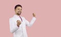 Portrait of happy excited handsome young man in white suit celebrating his success Royalty Free Stock Photo