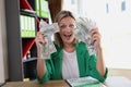 Happy excited woman holding fan of money Royalty Free Stock Photo