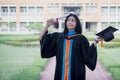 A happy and excited young Asian female university graduate Royalty Free Stock Photo