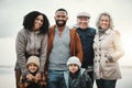 Portrait, happy and extended family or excited people bonding spending quality time together on holiday. Beach, winter Royalty Free Stock Photo