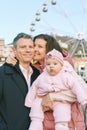 portrait of happy family with adorable baby girl at Christmas market Royalty Free Stock Photo