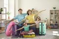 Portrait of happy family ready for holiday trip pretending to fly like a plane at home Royalty Free Stock Photo