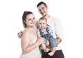 Portrait of the happy family with baby boy standing on white background. Royalty Free Stock Photo