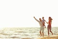 Portrait of happy family and baby enjoying sunset in the summer leisure Royalty Free Stock Photo