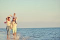 Portrait of happy family and baby enjoying sunset in the summer leisure Royalty Free Stock Photo