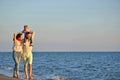 Portrait of happy family and baby enjoying sunset in the summer leisure Royalty Free Stock Photo