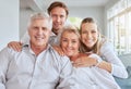 Portrait of happy family bonding over the weekend on couch together. Parents visiting their adult son and daughter with Royalty Free Stock Photo