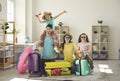 Portrait of happy family with daughters ready to fly to tropical resort Royalty Free Stock Photo