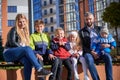 Happy family - father, mother and children having fun together on playground. Royalty Free Stock Photo