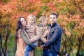 Portrait of happy family of four in autumn day Royalty Free Stock Photo