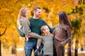 Portrait of happy family of four in autumn day Royalty Free Stock Photo