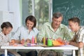 Portrait of happy family of four drawing together at home Royalty Free Stock Photo