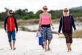 Portrait of happy family and friends walking on the beach Royalty Free Stock Photo