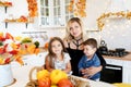 Portrait of happy family gathered at festive table on Thanksgiving Day